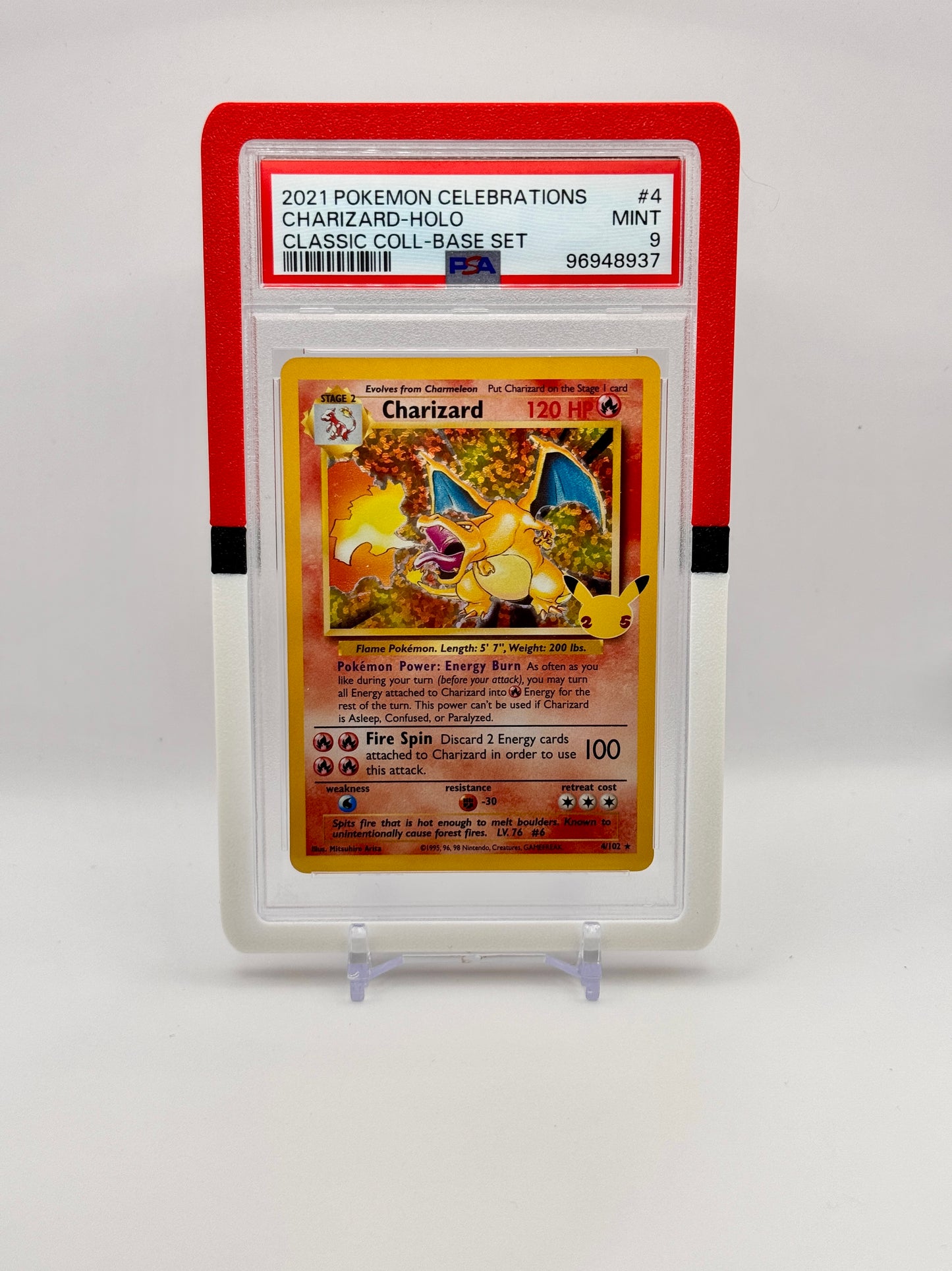 Pokémon trading card featuring Charizard in a protective case on a white background